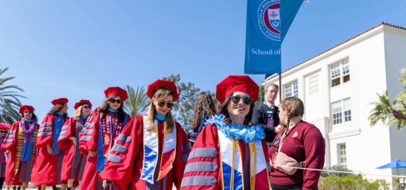 Students at a doctoral graduation.